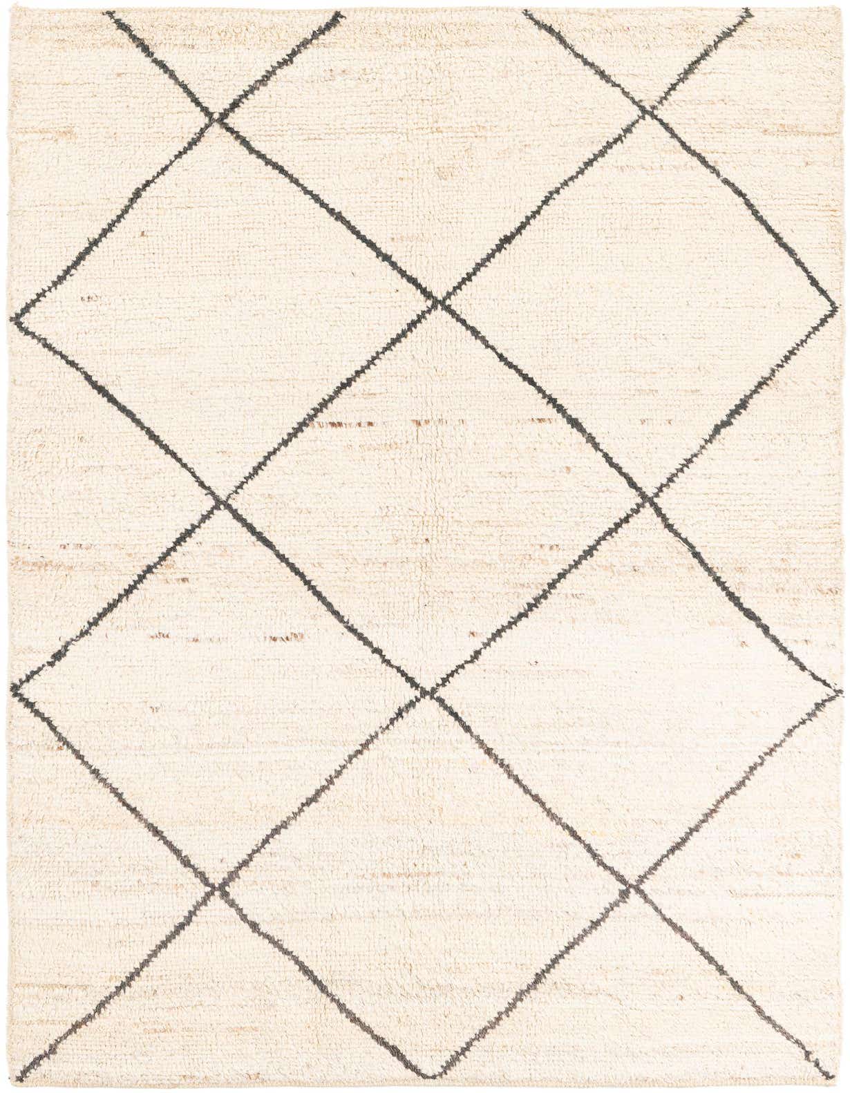 A 5x8 rectangular ivory shag rug with a black tribal diamond pattern, perfect for a living room.