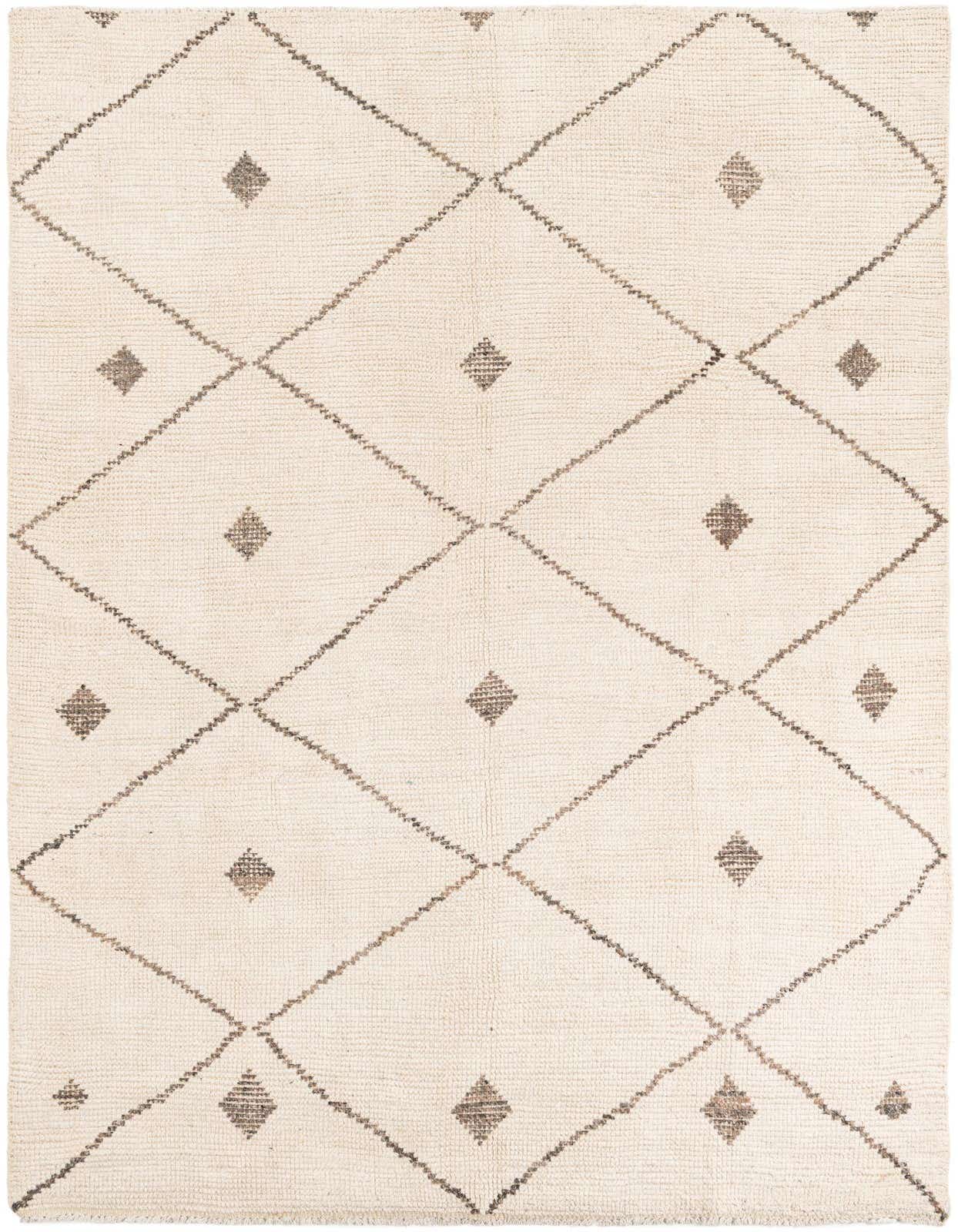 A 6x9 rectangular ivory shag rug with a modern tribal diamond pattern in dark brown, suitable for a living room or bedroom.