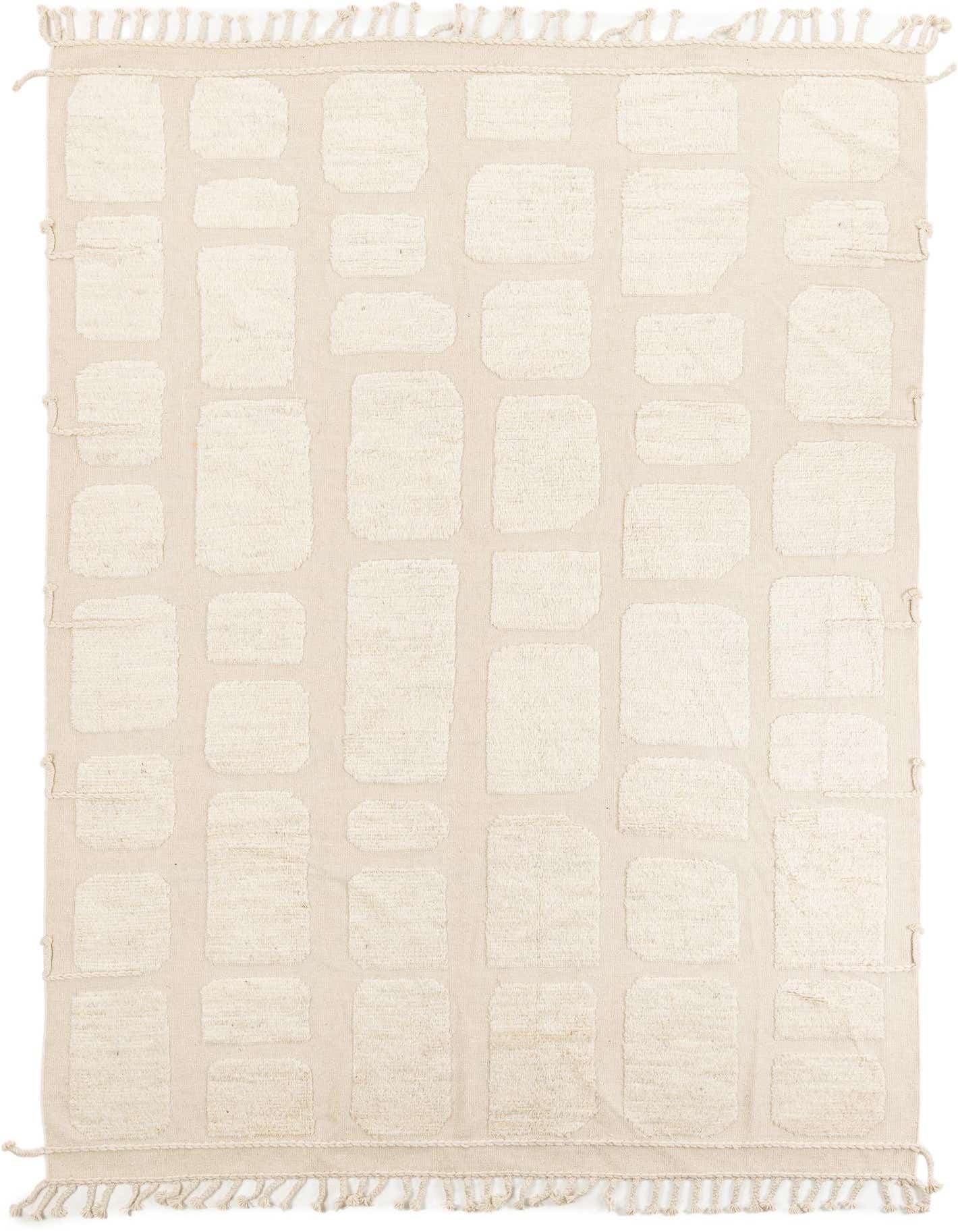 An 8x11 rectangular ivory wool shag rug with a modern tribal abstract pattern of raised cream blocks and fringe.