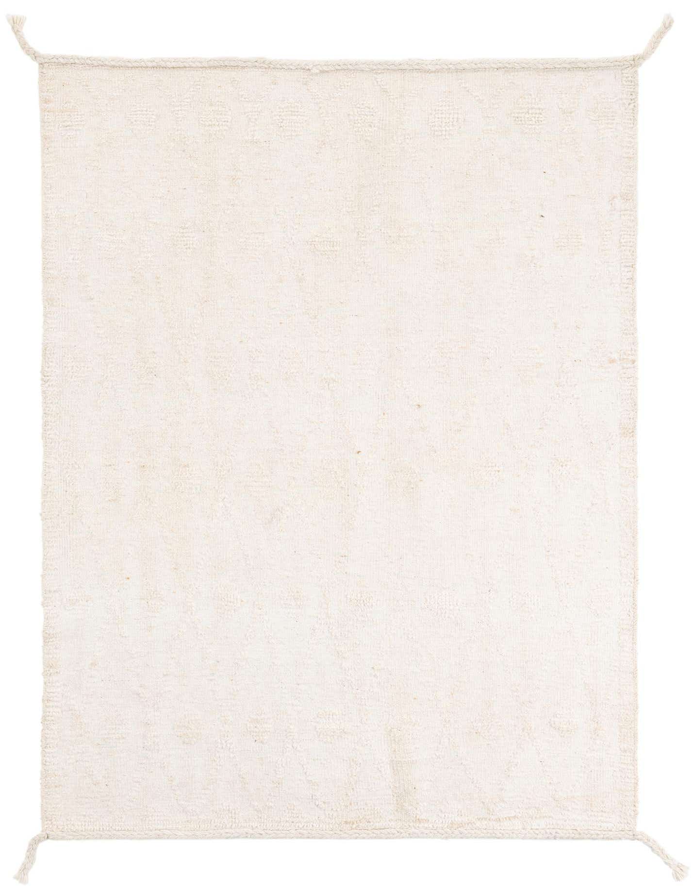 A 4x6 rectangular ivory wool shag rug with subtle tribal patterns and braided edges, suitable for a living room.