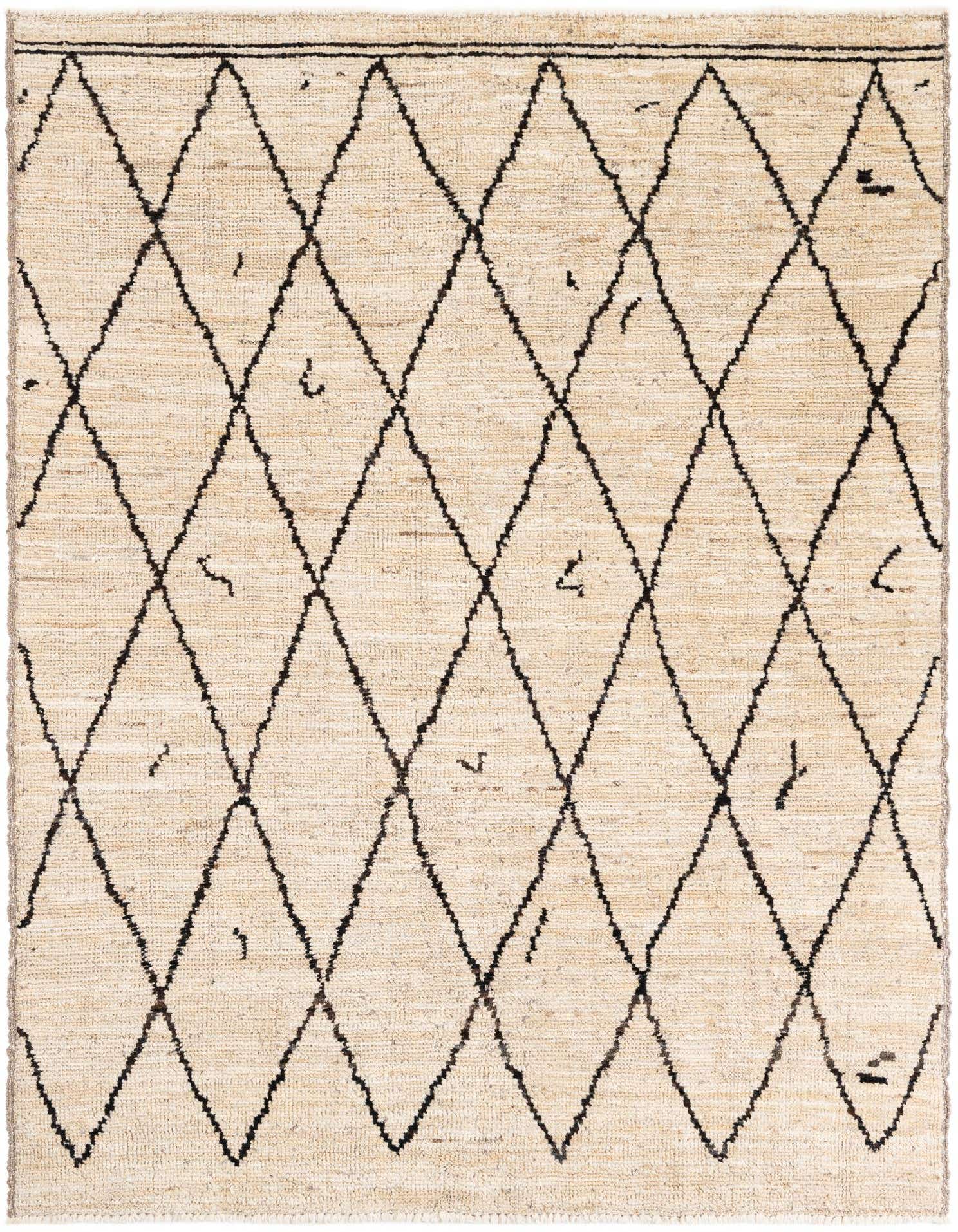 A 5x8 rectangular ivory wool shag rug with a black tribal diamond pattern, perfect for a living room.