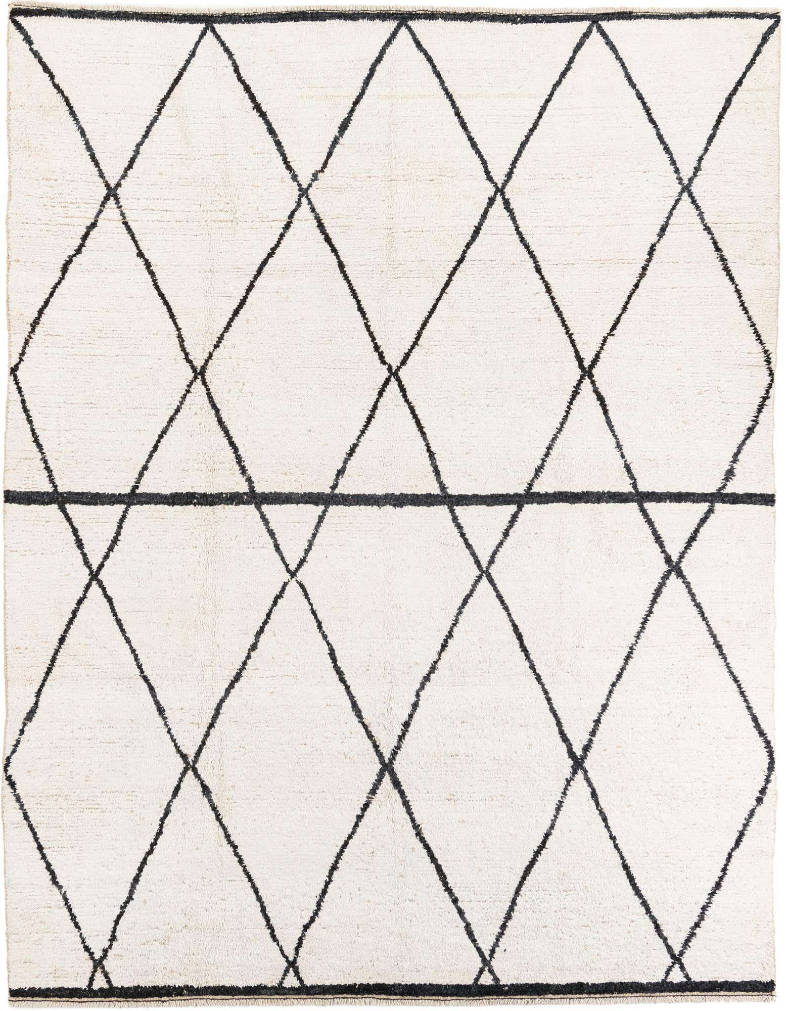 A rectangular 8x10 ivory shag rug with a bold black tribal diamond pattern, perfect for a living room.