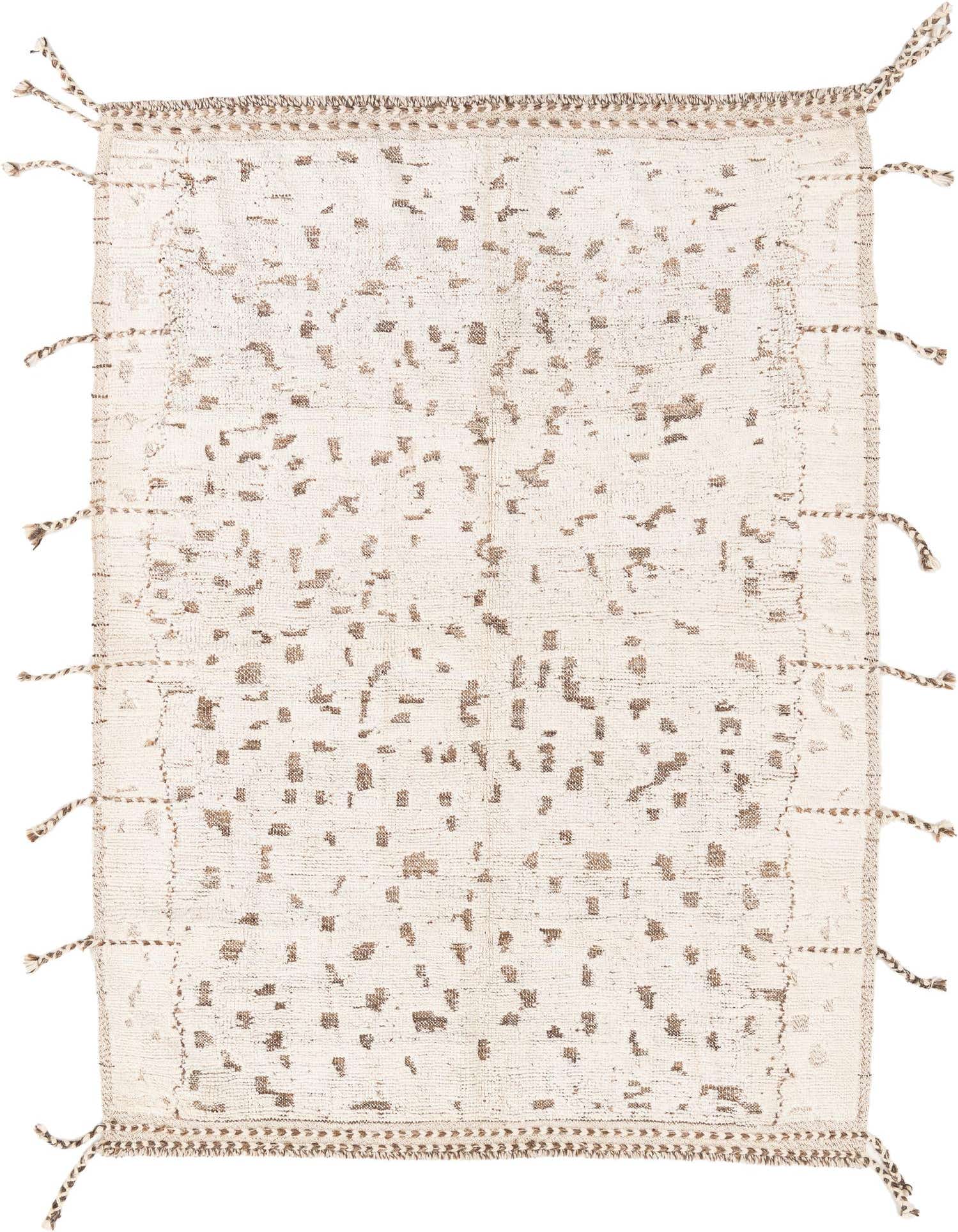A 5x8 rectangular ivory wool shag rug with an abstract tribal pattern in subtle brown tones and braided tassels.
