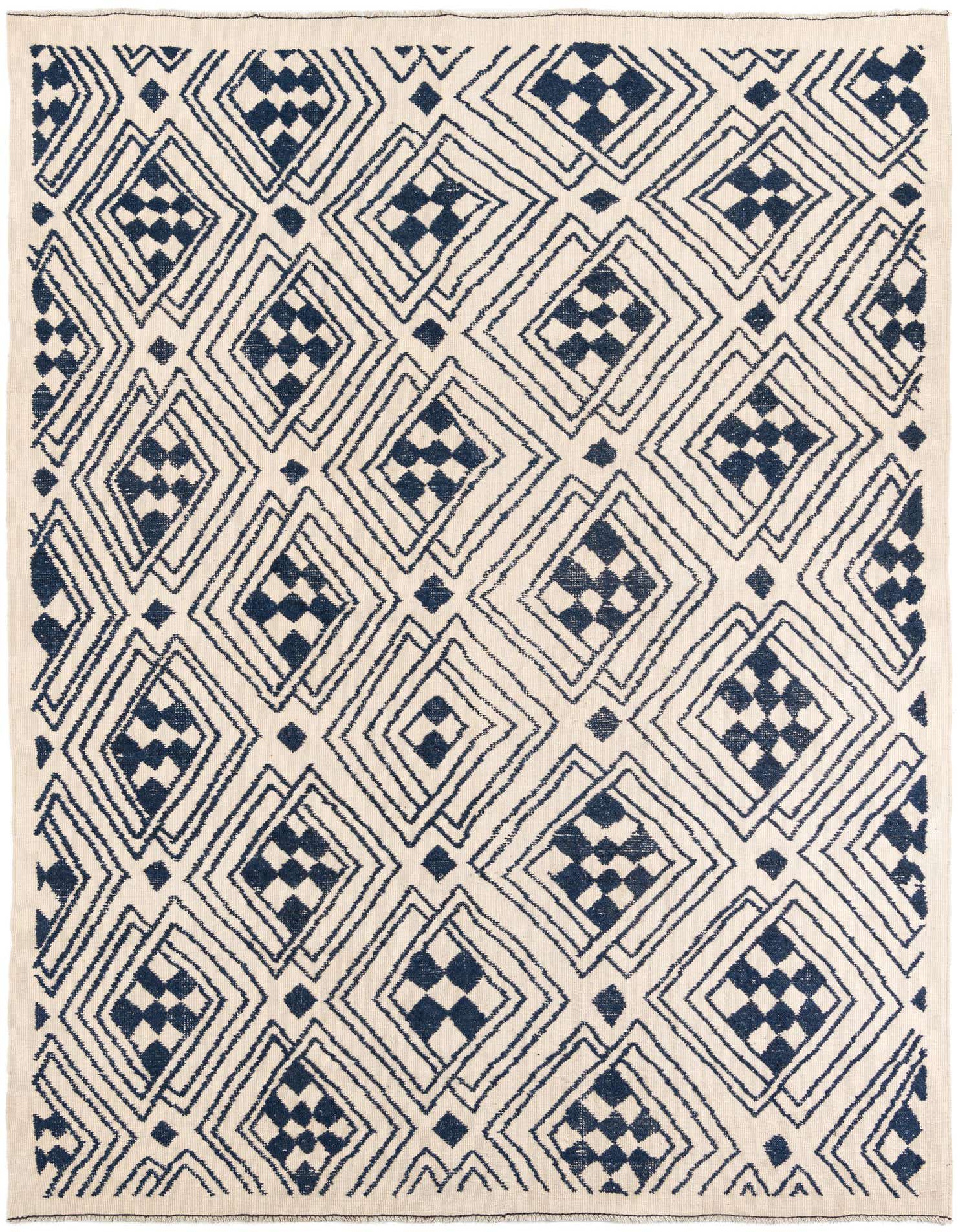 A 9x12 rectangular ivory shag rug with a modern tribal pattern of interlocking navy blue diamonds.