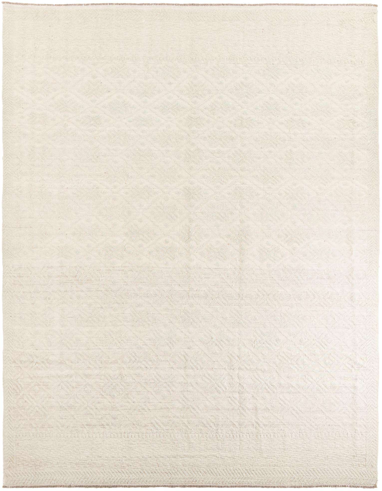 A 9x12 rectangular ivory wool shag rug with subtle tribal patterns, perfect for a living room.