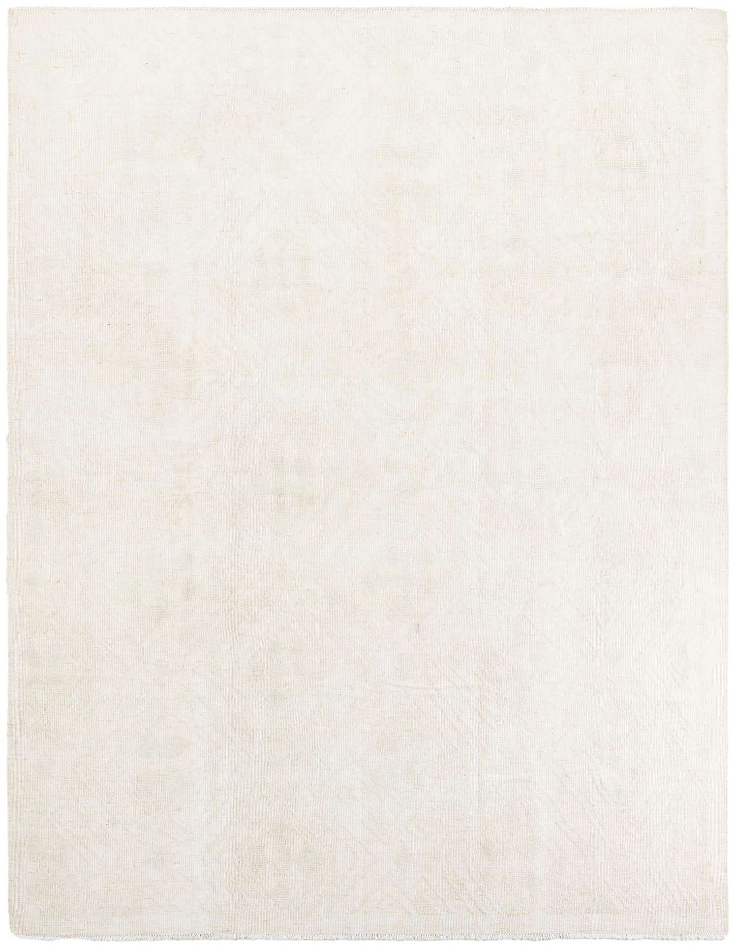 A 9x12 rectangular ivory shag rug with a subtle tribal pattern, perfect for a living room or bedroom.