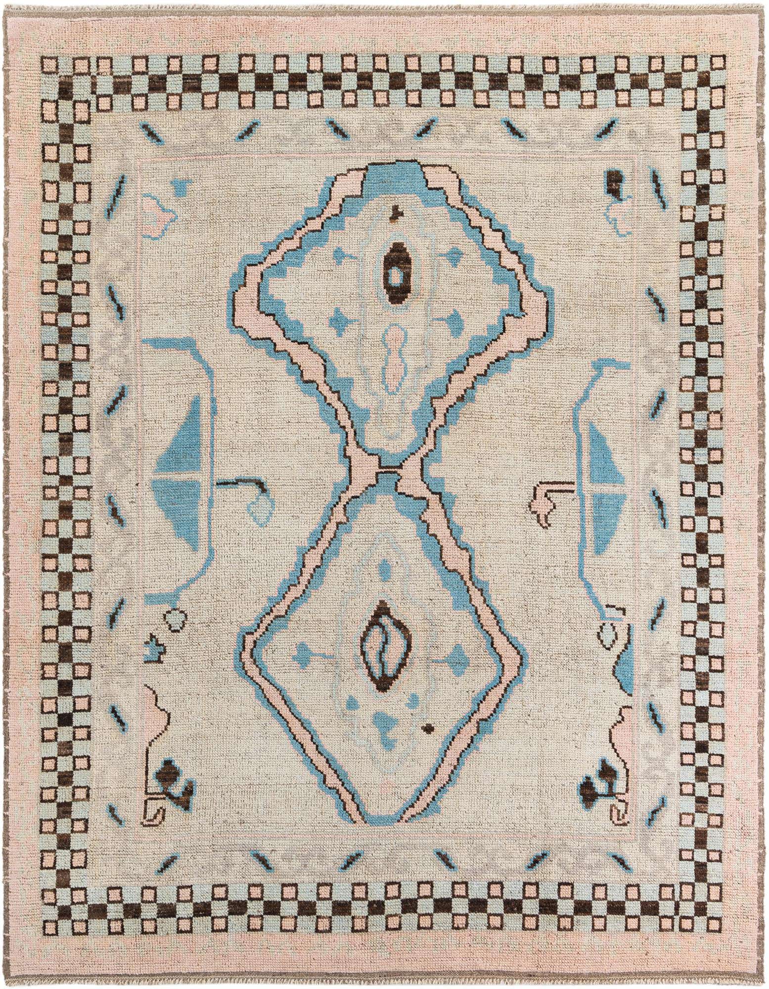 A 9x11 rectangular ivory wool shag rug with a pink and blue tribal medallion pattern and a checkered border.
