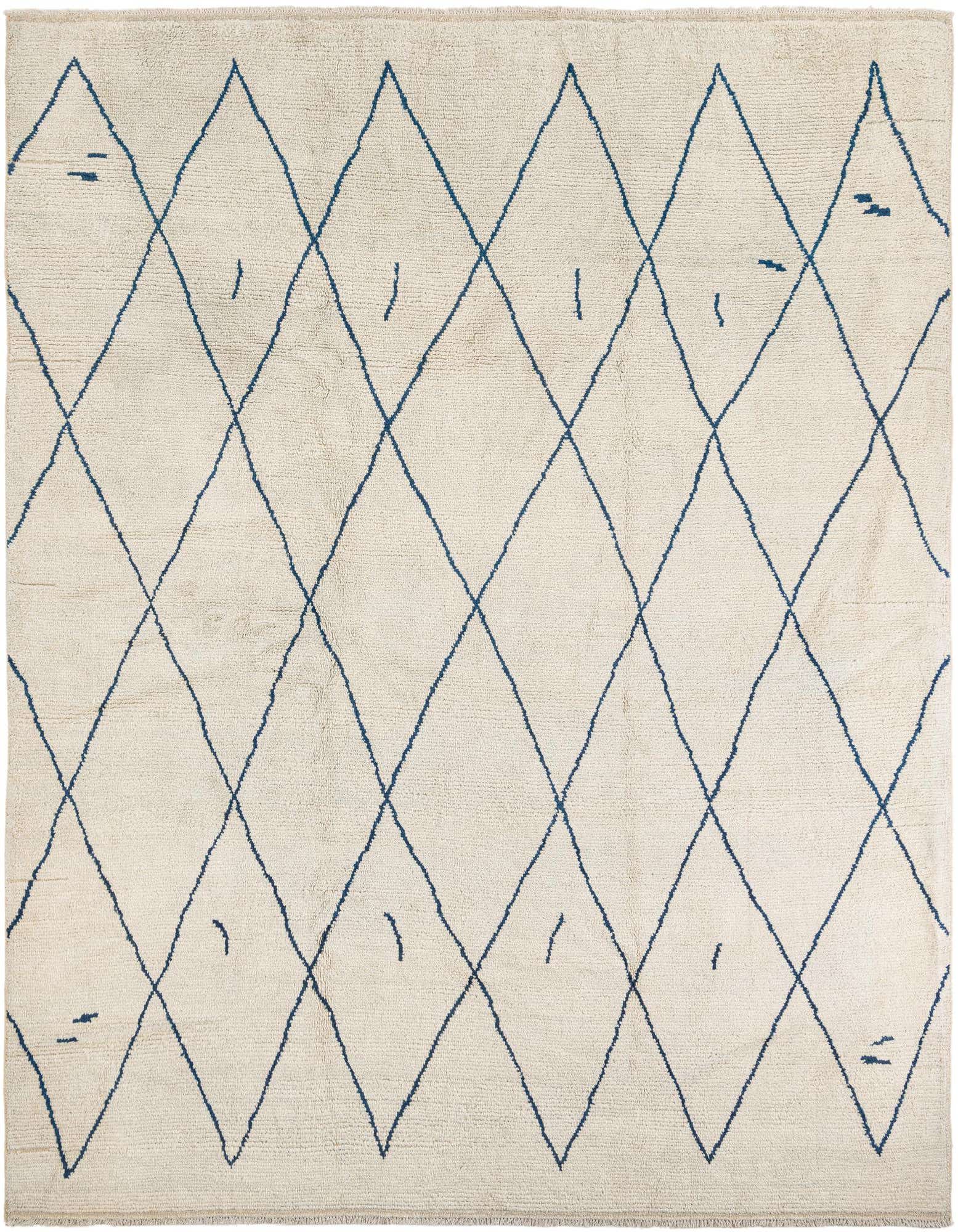 A 9x12 rectangular ivory shag rug with a modern tribal diamond pattern in dark blue, suitable for a living room.