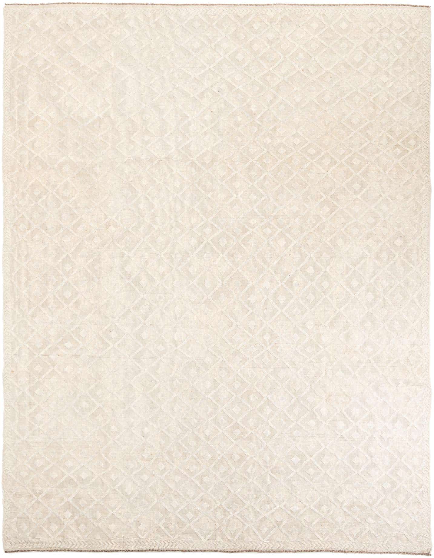 A 9x12 rectangular ivory and cream wool shag rug with a subtle tribal diamond pattern, perfect for a modern living room.