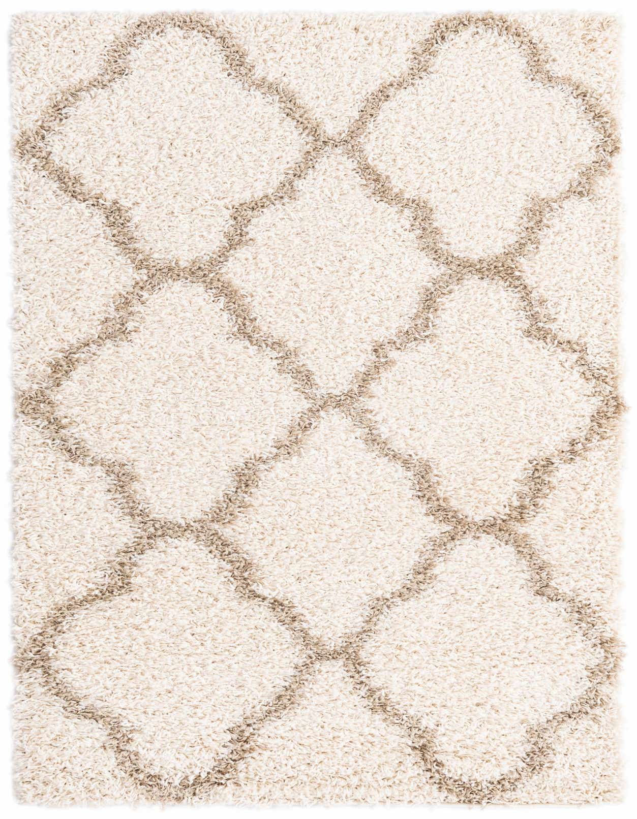 A 3x5 rectangular ivory shag rug with a modern tribal trellis pattern in light brown, suitable for an indoor living space.