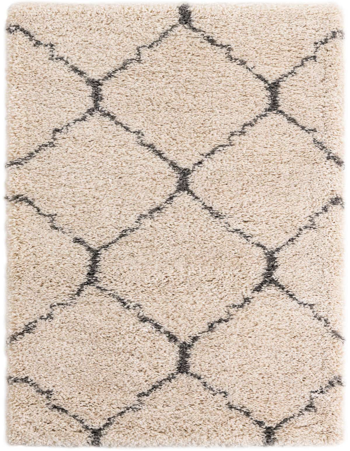 A rectangular 3x5 ivory shag rug with a modern charcoal gray trellis pattern, ideal for a cozy living room.