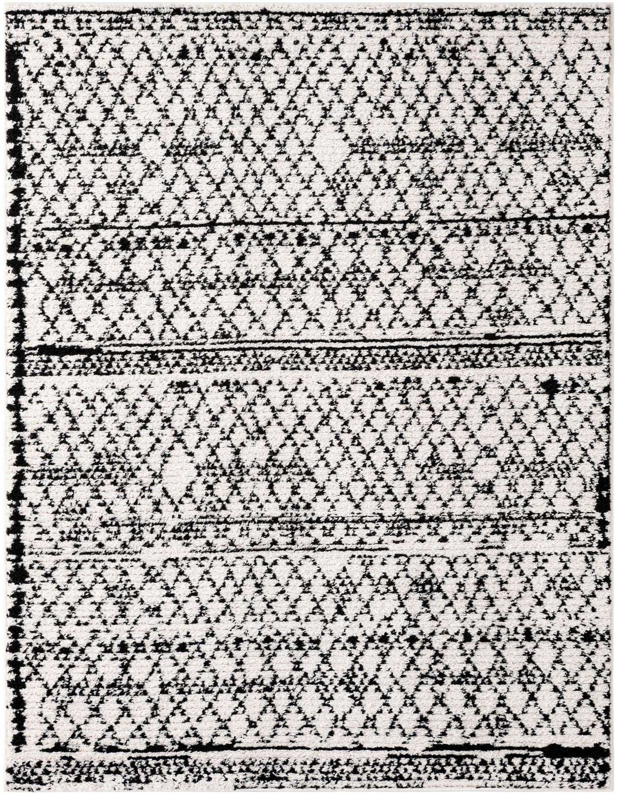 A rectangular 5x8 ivory and black shag rug with a bohemian trellis pattern, perfect for a living room or bedroom.