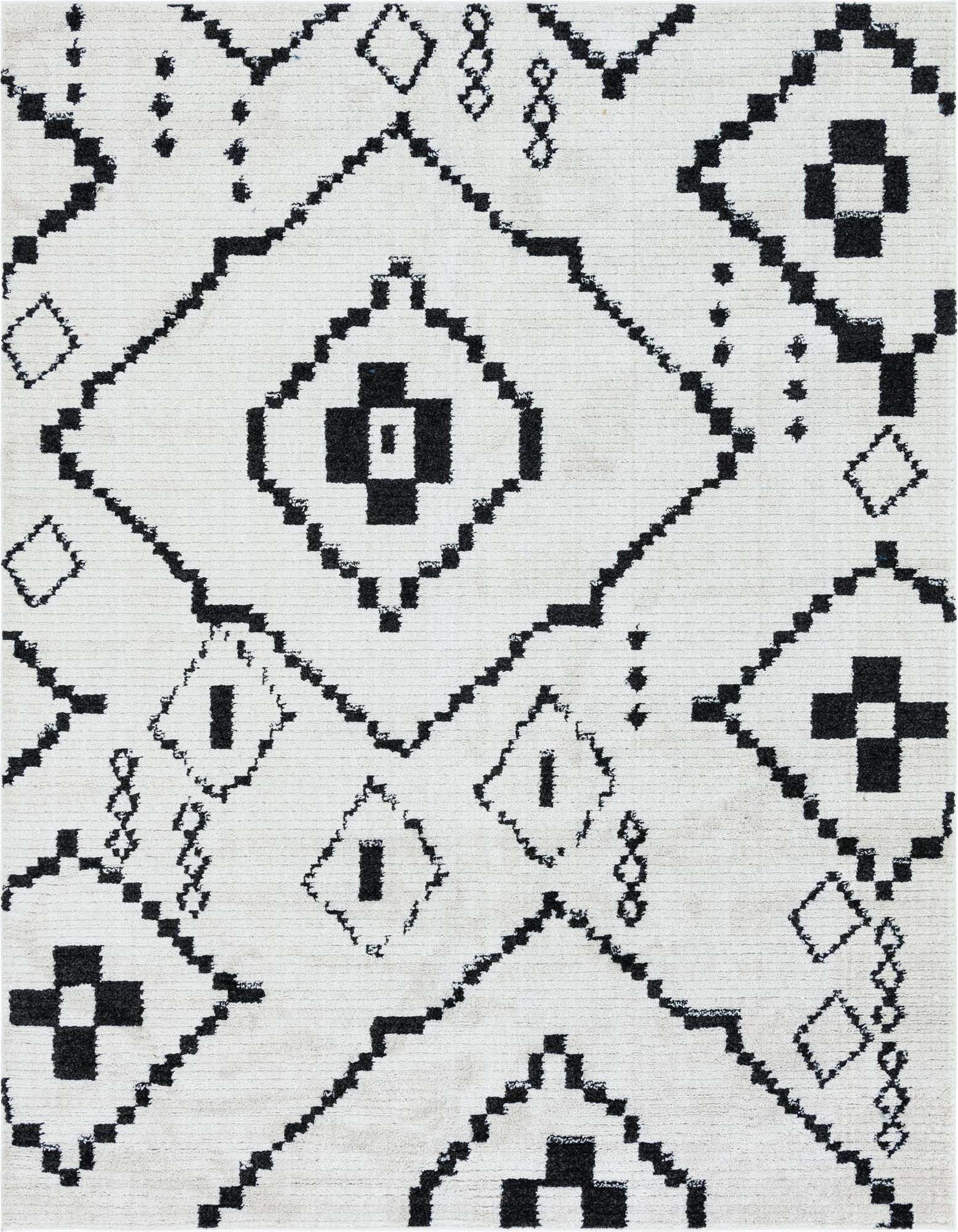A close-up of an 8x10 rectangular ivory shag rug featuring a bold black tribal geometric pattern.