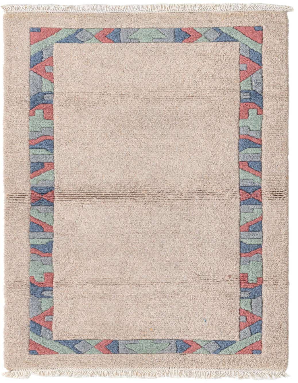 A 3x5 rectangular ivory wool rug with a colorful modern geometric border in blue, red, and green.