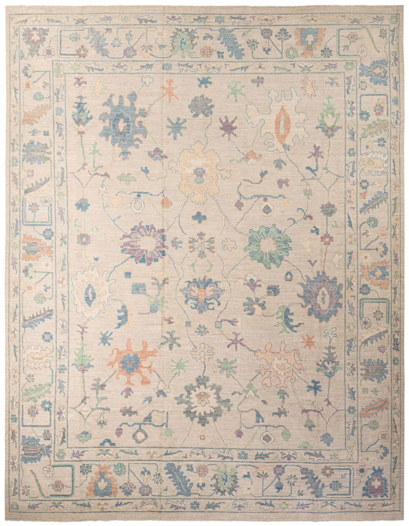 A large 12x15 rectangular ivory wool rug with a modern floral Oushak pattern in muted blues, greens, purples, and oranges.