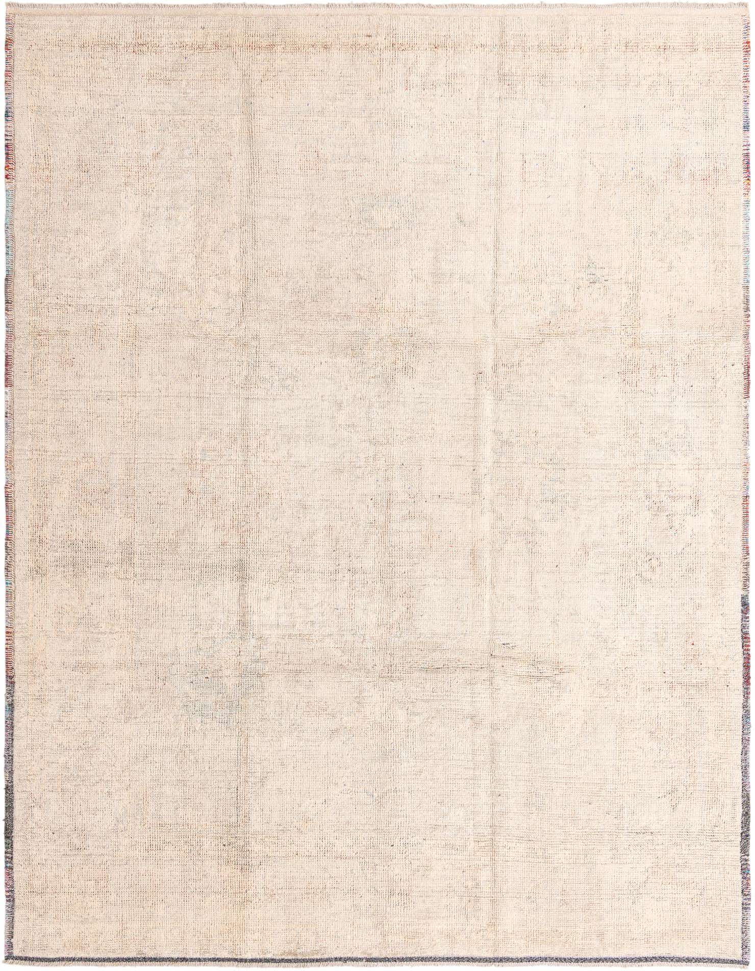 A 9x12 rectangular ivory and cream modern wool rug with subtle distressed patterns and fringed edges.