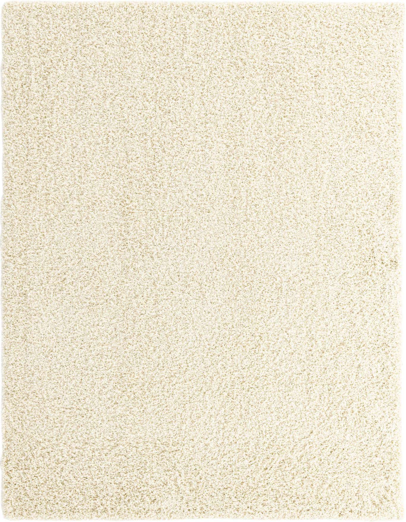 A soft, rectangular 6x9 ivory shag rug with a textured pile, perfect for a modern living room or bedroom.
