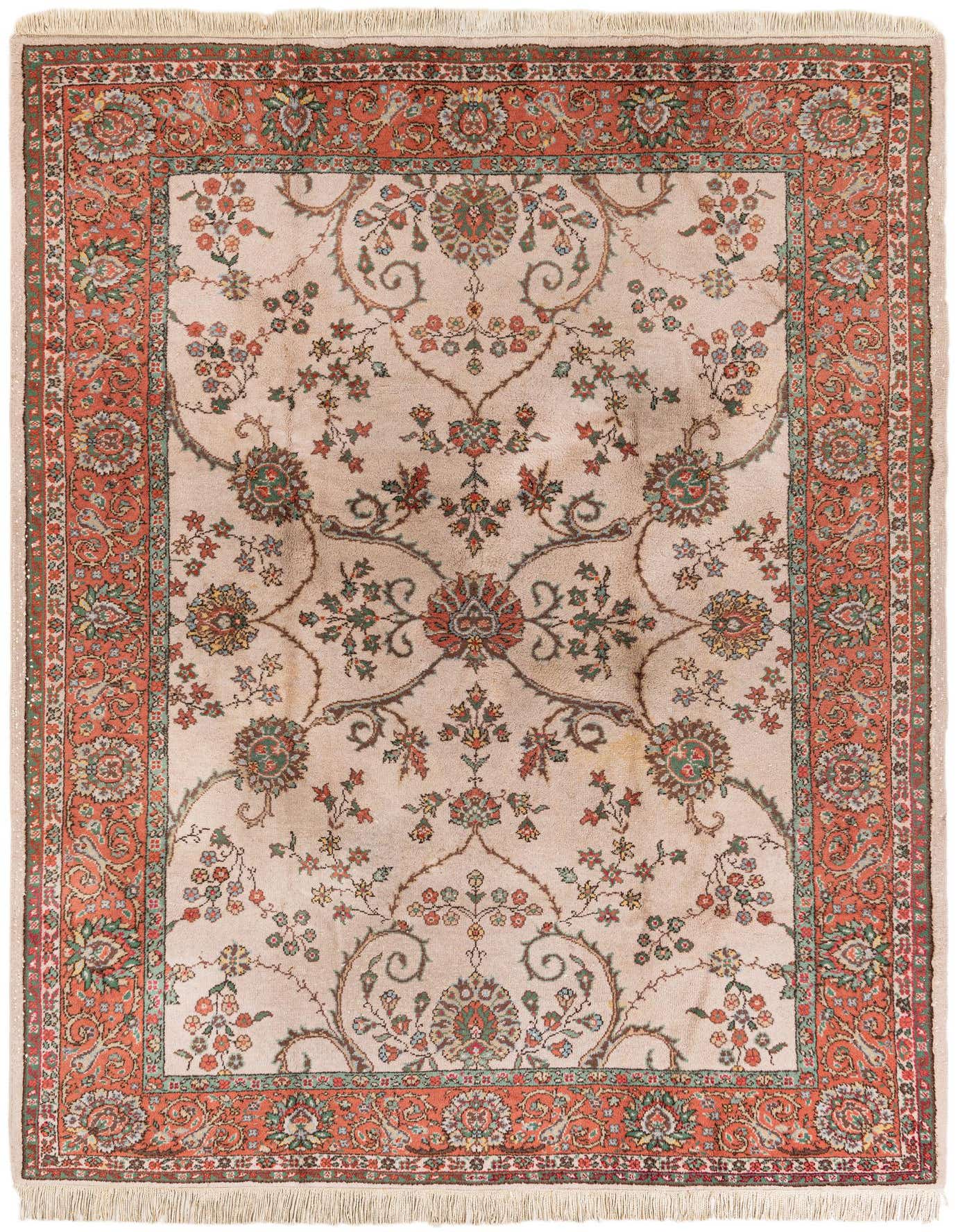 A 7x10 rectangular ivory Oriental rug with a detailed floral and vine pattern in muted reds, greens, and blues, featuring a prominent coral border.