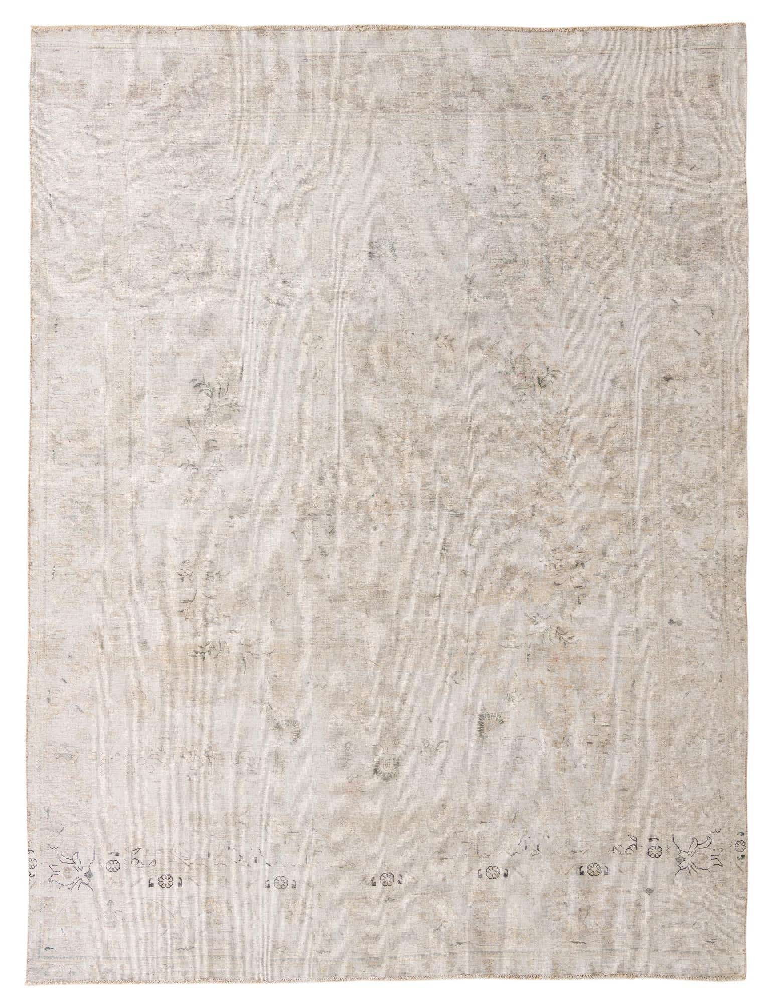 A 9x12 rectangular ivory and cream wool rug with a subtle, faded Persian pattern, ideal for a living room.