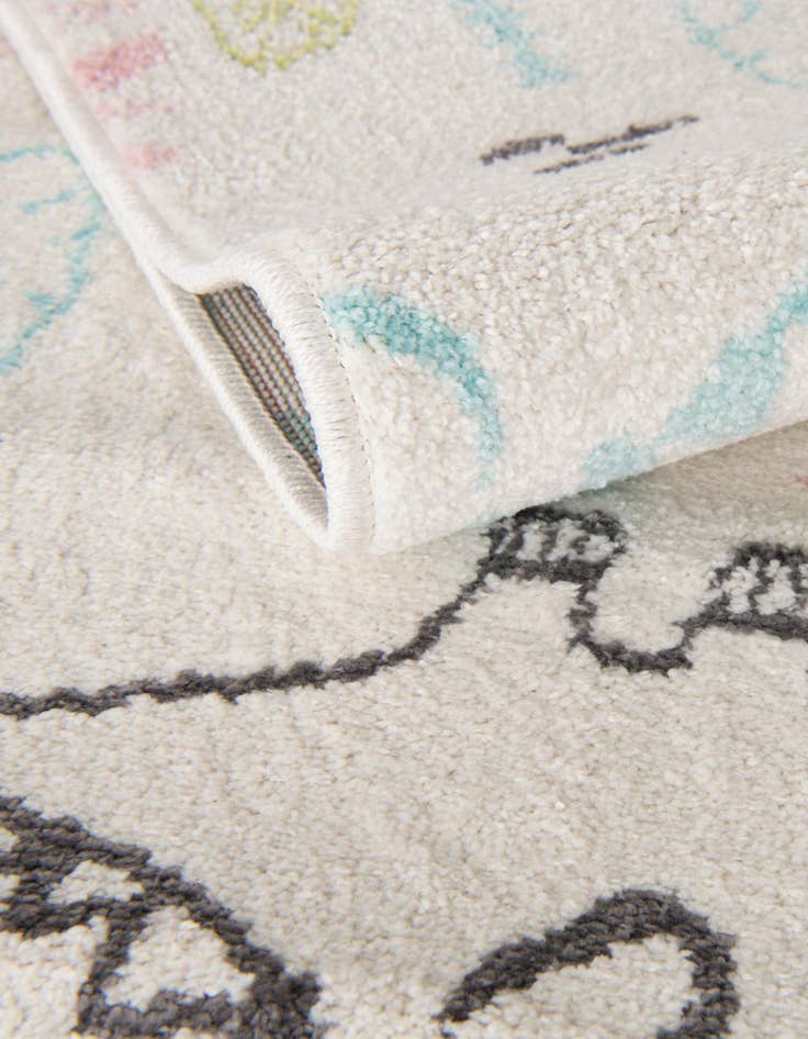Detail image of  3' 11 x 5' 11 Dinosaur Whimsy Kids Rug