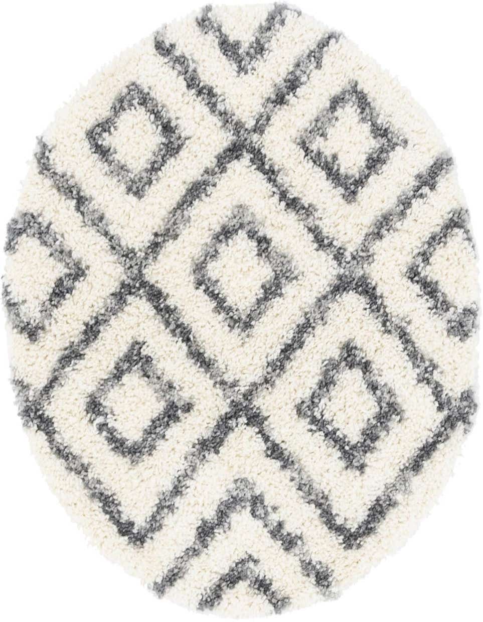 A round ivory shag rug with a modern geometric diamond pattern in charcoal gray, offering a plush texture.