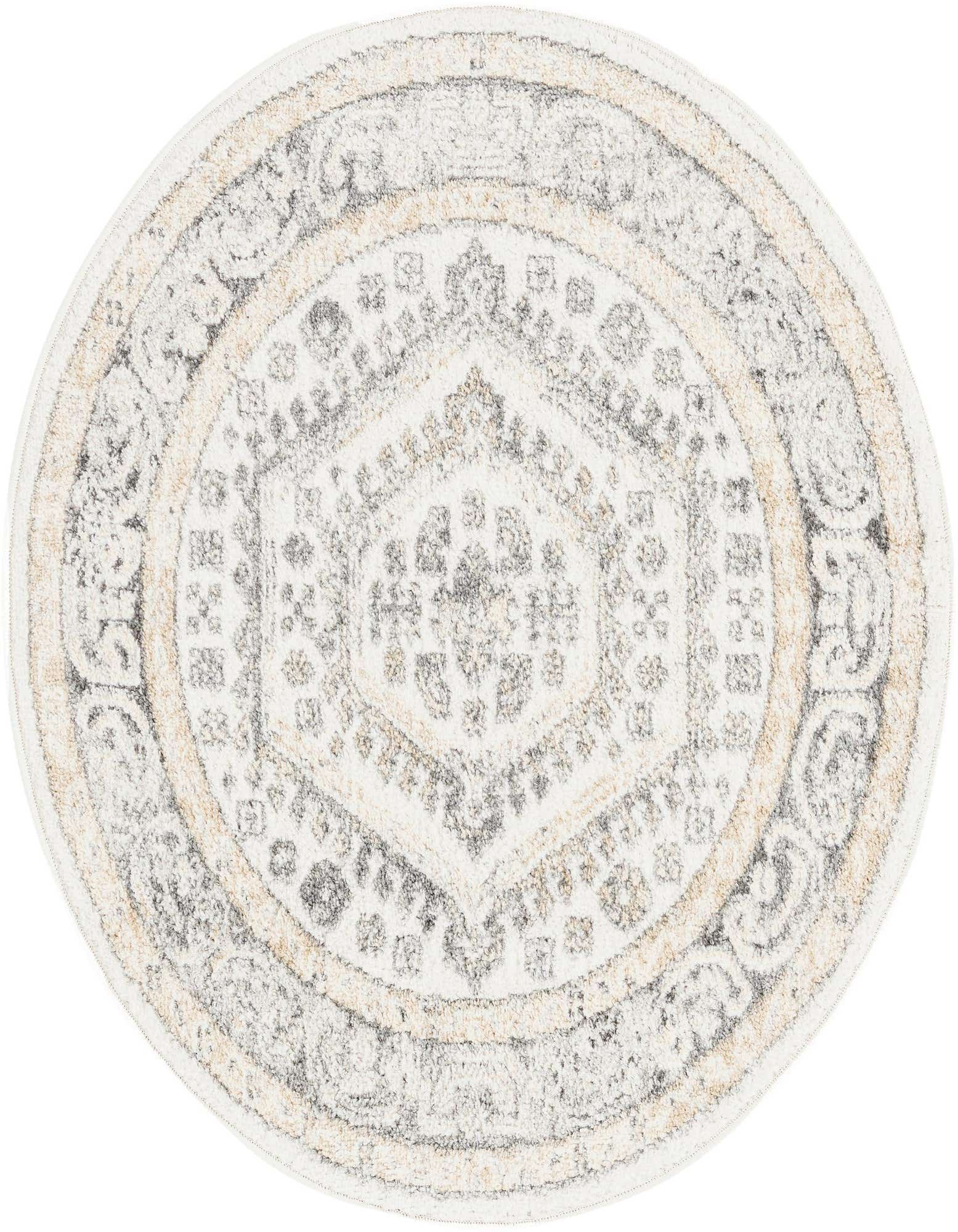 A 3' round ivory and cream rug with a distressed traditional medallion pattern and tribal accents.