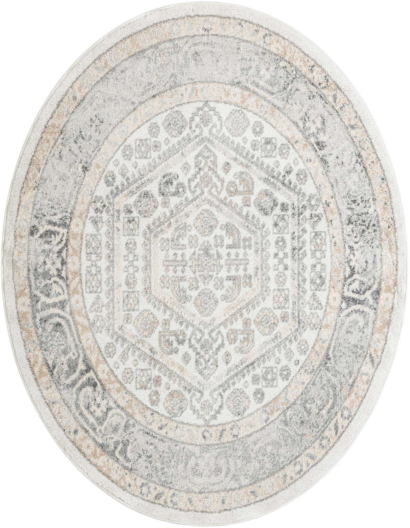 A 6' 1 round ivory and cream rug with a distressed traditional medallion and tribal pattern, featuring gray and beige accents.