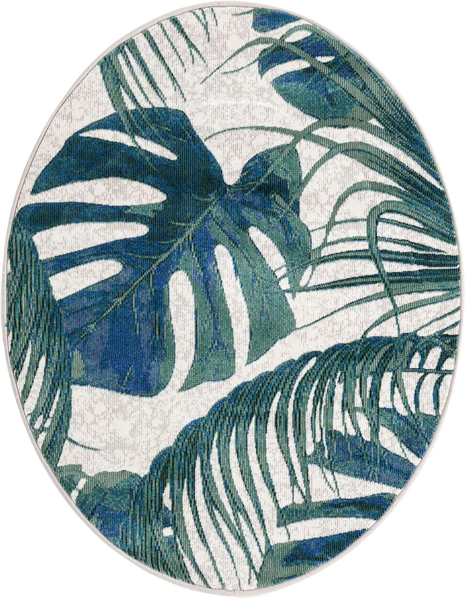 A round ivory rug featuring large, vibrant blue and green tropical monstera and palm leaves, perfect for a modern indoor space.