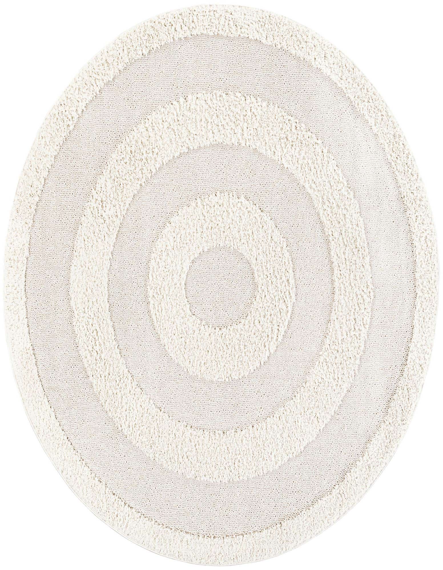 A round ivory and cream rug with a modern medallion pattern featuring concentric circles of varying pile heights.