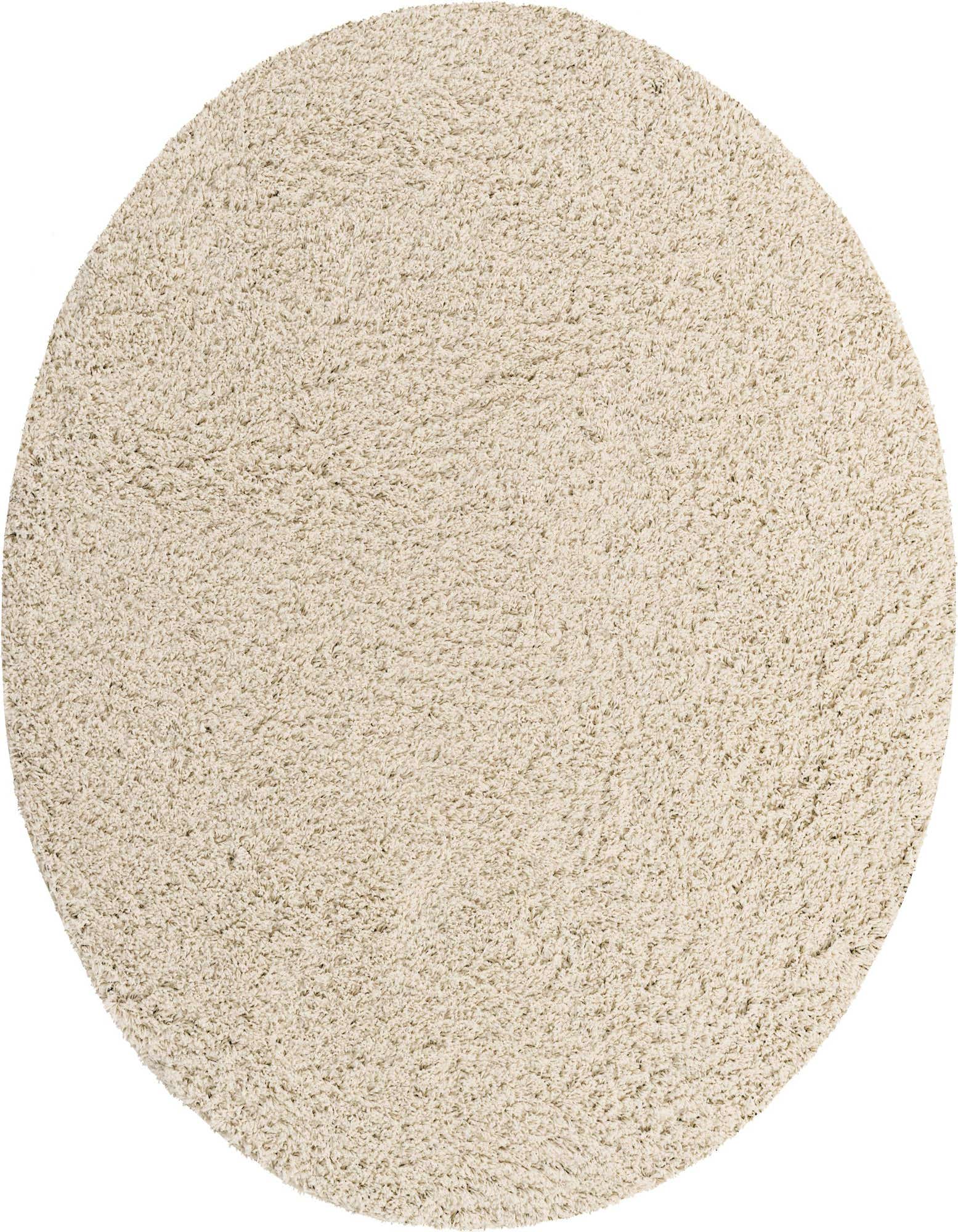 A 3' 3 x 3' 3 round ivory shag rug, made of soft polypropylene, shown from above.