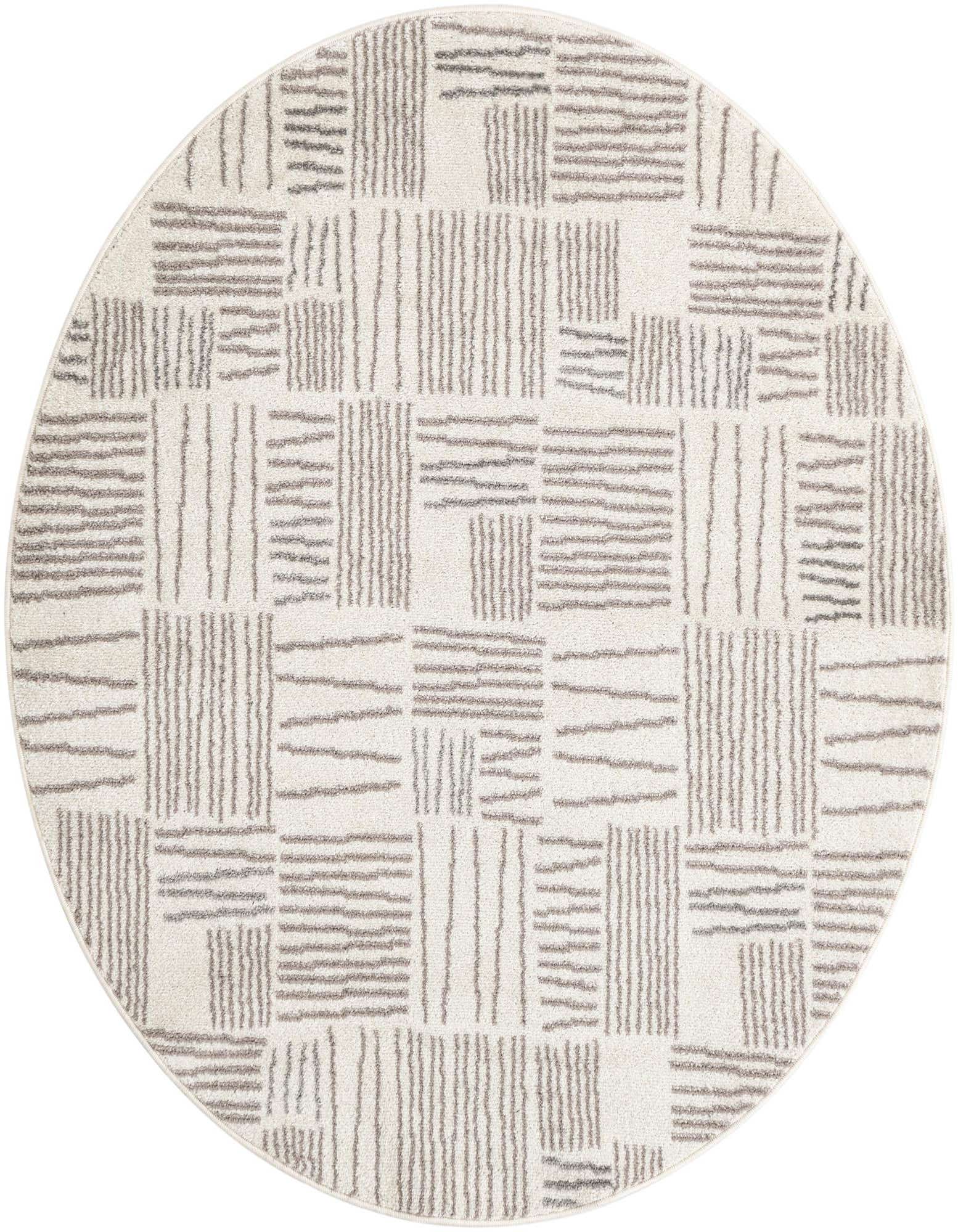 A 5' 3 round ivory and cream rug with a modern abstract pattern of short gray vertical and horizontal lines.