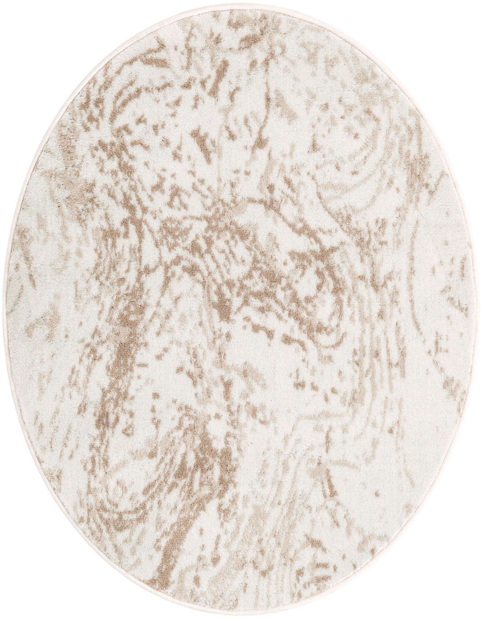 A round ivory and cream rug with a modern abstract pattern, made from polypropylene, suitable for indoor use.