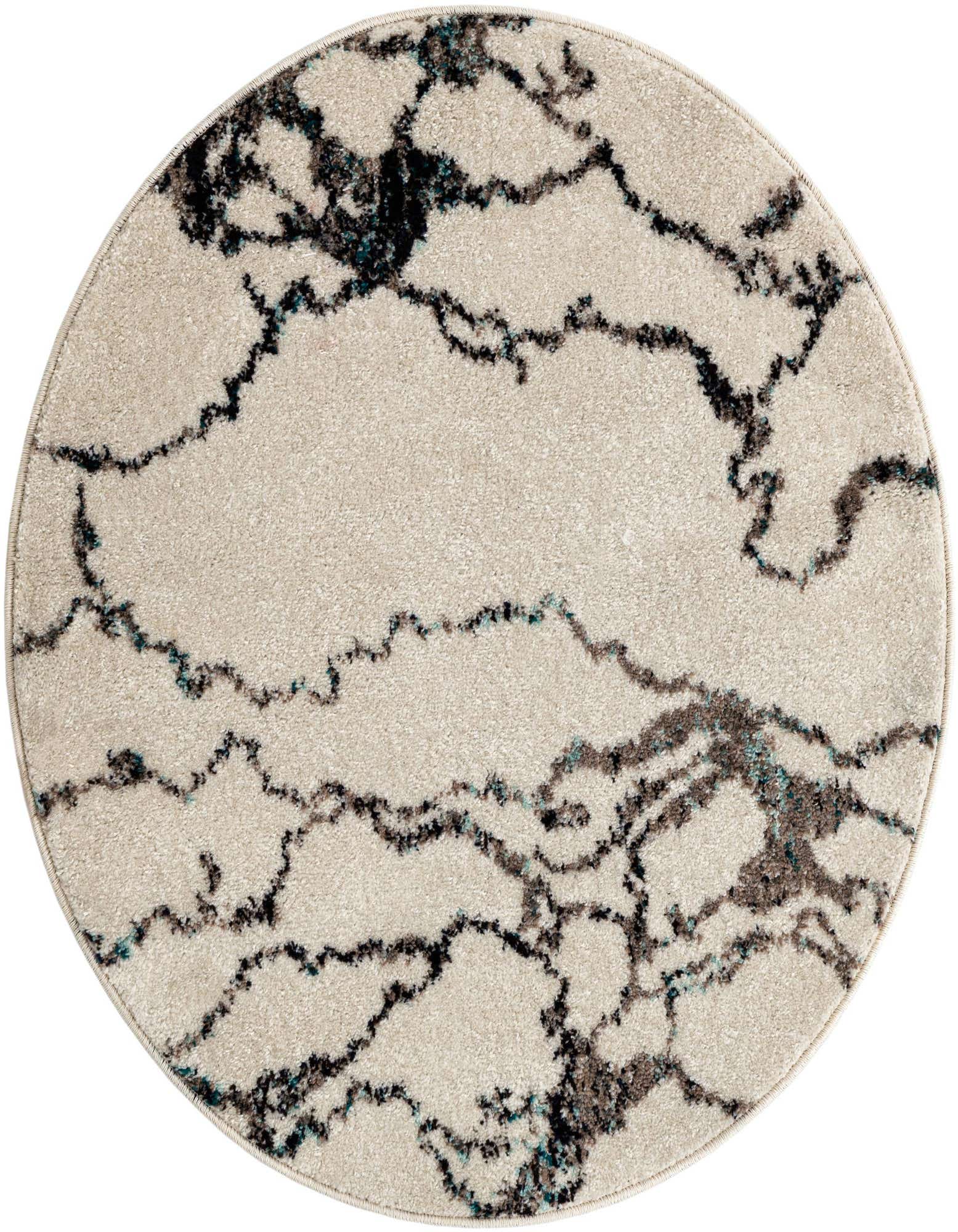 A round ivory and cream rug with a distressed, abstract pattern in black and teal, suitable for a living room or patio.
