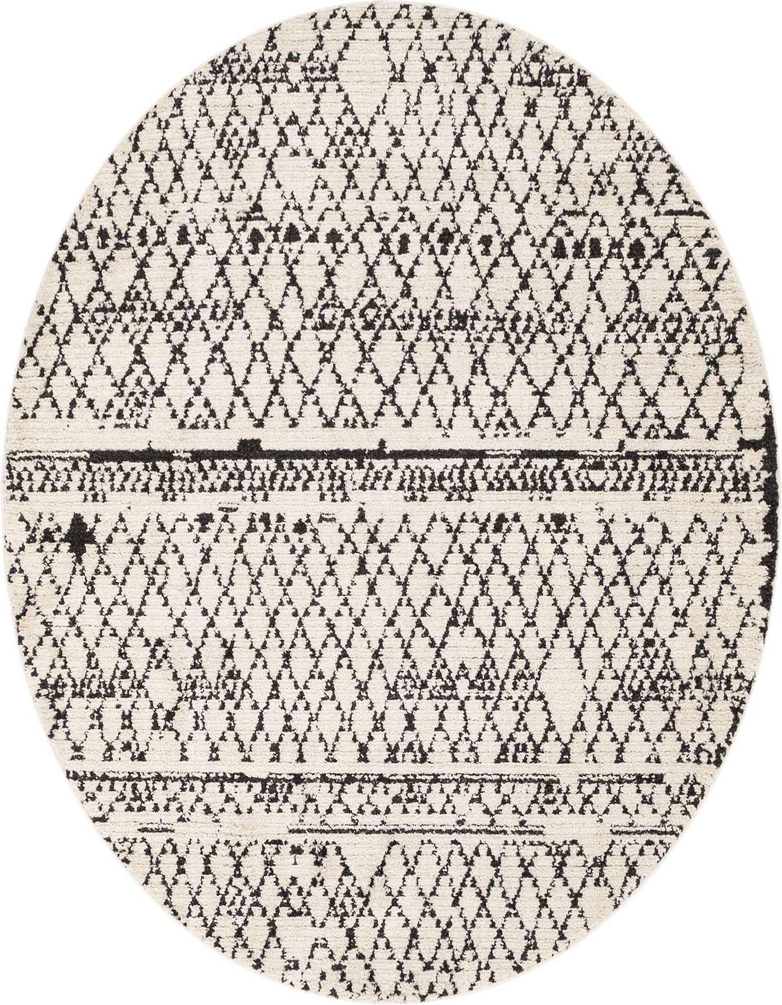 A round ivory and black Bohemian shag rug featuring a tribal trellis pattern with textured pile.