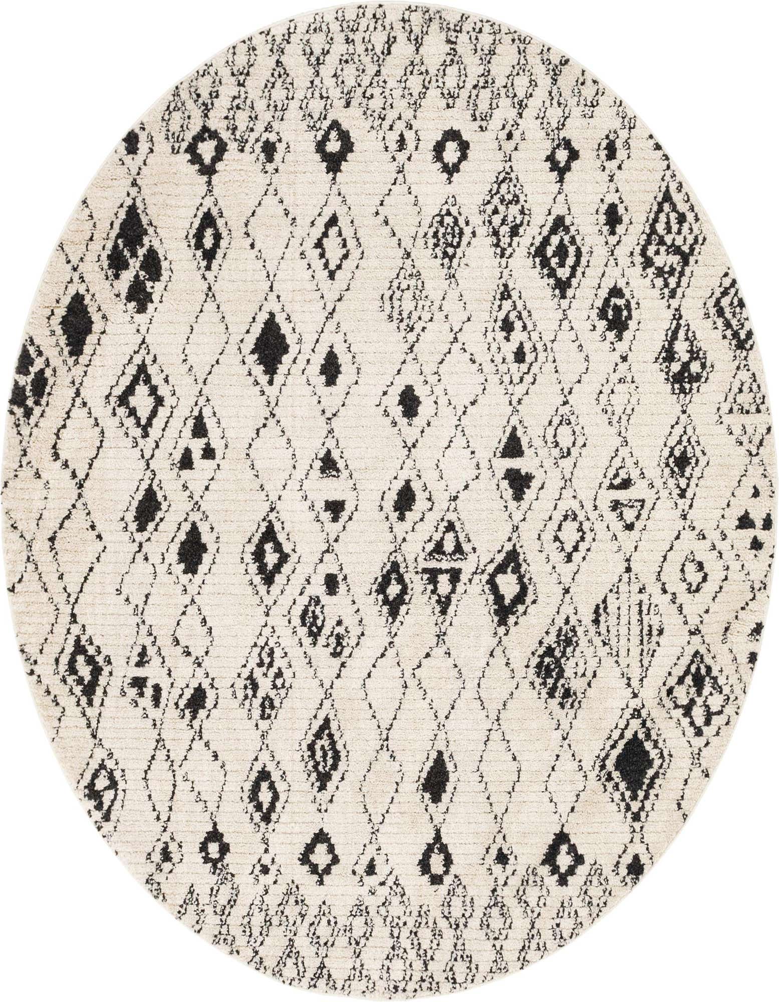 A round ivory and black shag rug with a bohemian tribal pattern of scattered diamonds and abstract shapes.