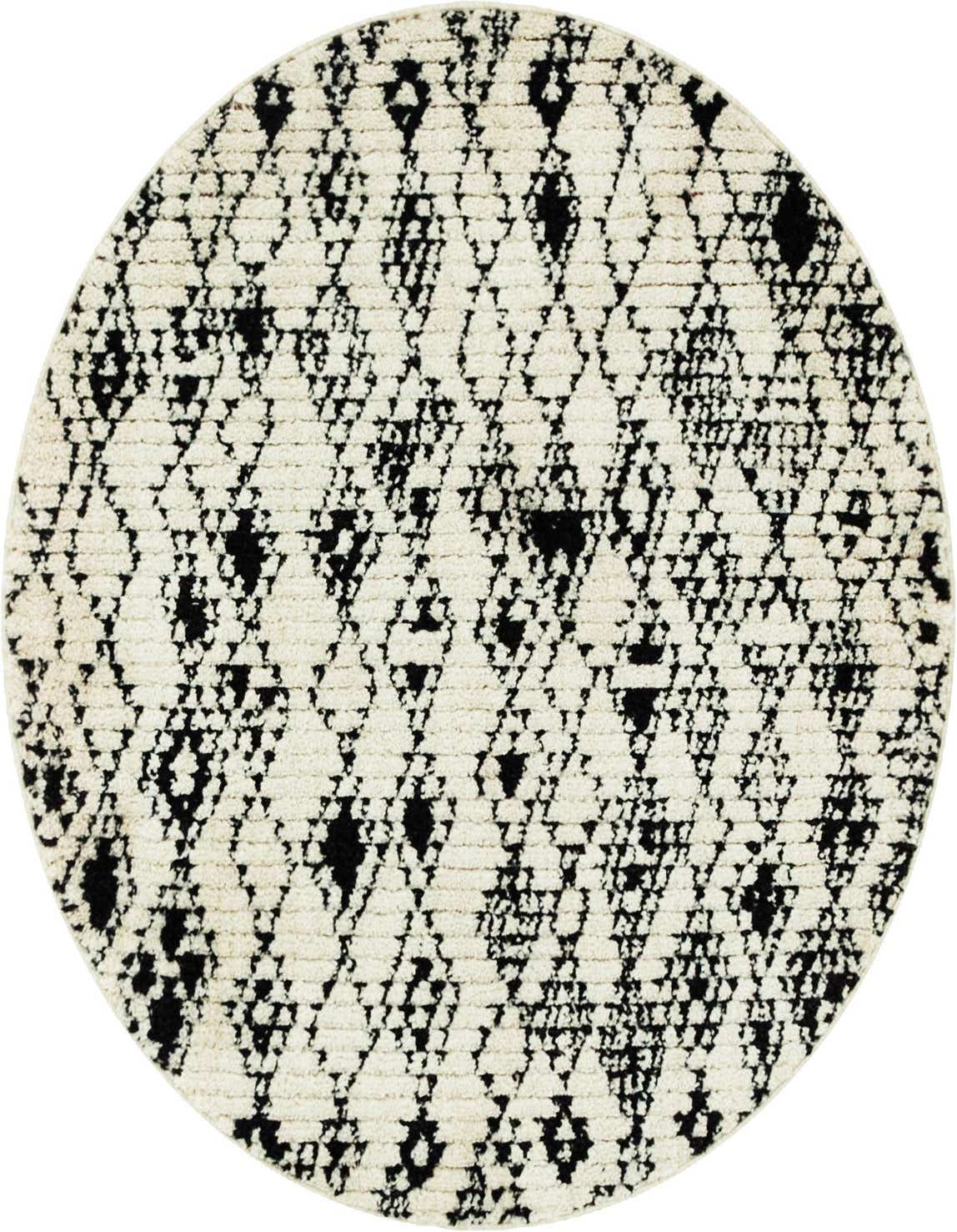 A round ivory and black shag rug featuring a textured tribal diamond pattern, perfect for a modern living space.