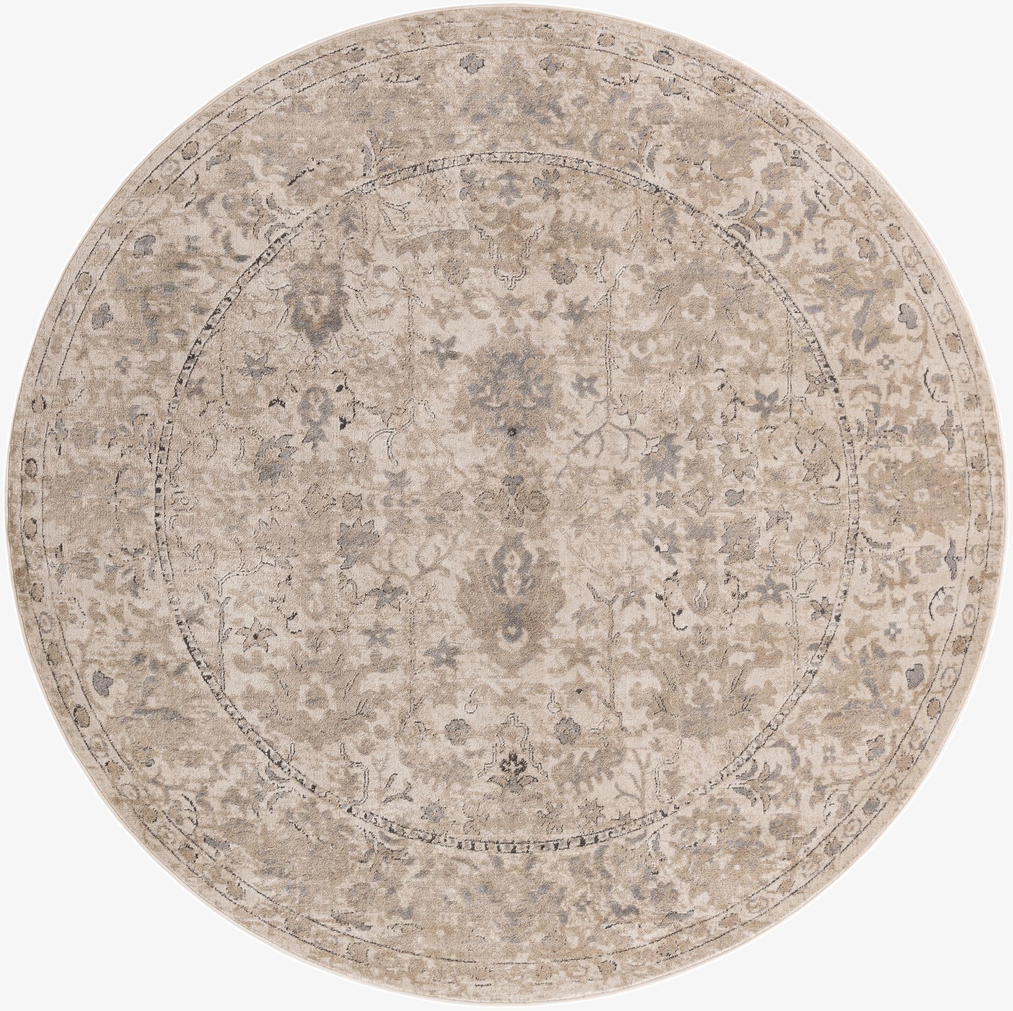 A 10-foot round ivory and cream rug with a distressed traditional floral pattern and a textured pile.