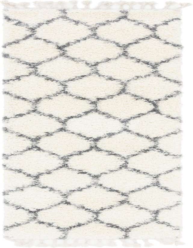 An 8 ft ivory runner rug with a modern geometric trellis pattern in gray, featuring a soft shag pile and decorative tassels.