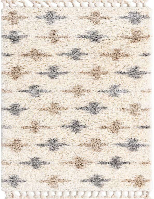 An 8 ft runner rug from the Athena Shag collection, featuring a creamy white shag pile with scattered gray and beige abstract cross patterns and tasseled ends, perfect for a hallway.