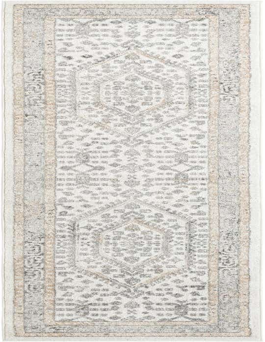 A 10 ft runner rug in ivories and creams with a traditional tribal medallion pattern, ideal for hallways.