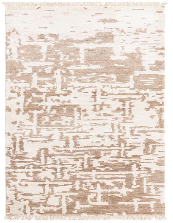A 10 ft runner rug with an abstract modern pattern in ivory and cream, featuring fringe on both ends.