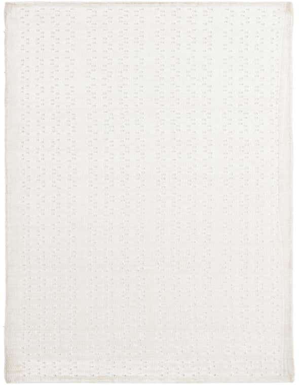 A 10 ft Darya runner rug in ivory and cream with a subtle modern oriental pattern, perfect for a hallway.