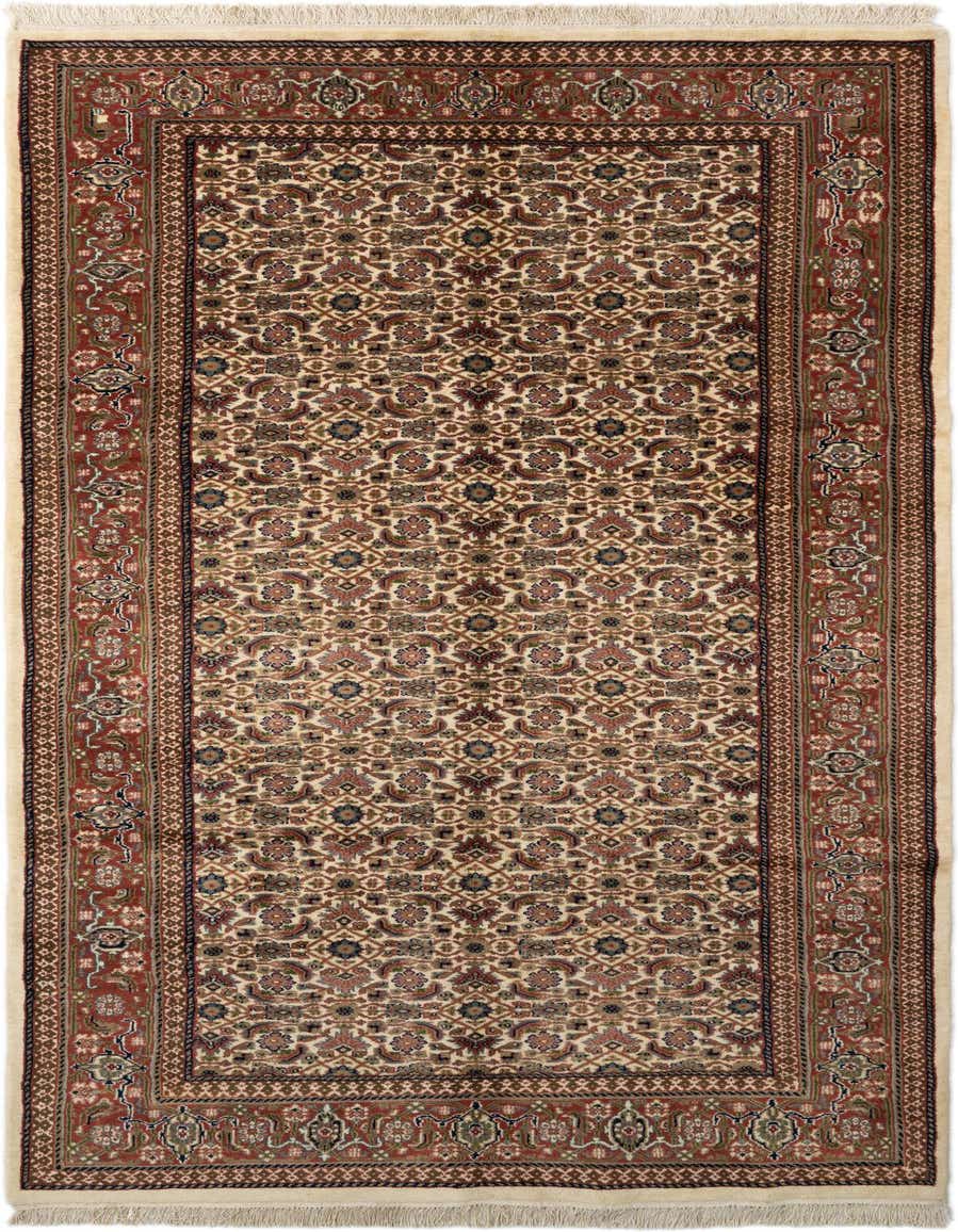 A handmade 11 Ft runner rug in a traditional Oriental pattern, featuring a cream field with intricate floral motifs in red, blue, and brown, bordered by a rich red frame.