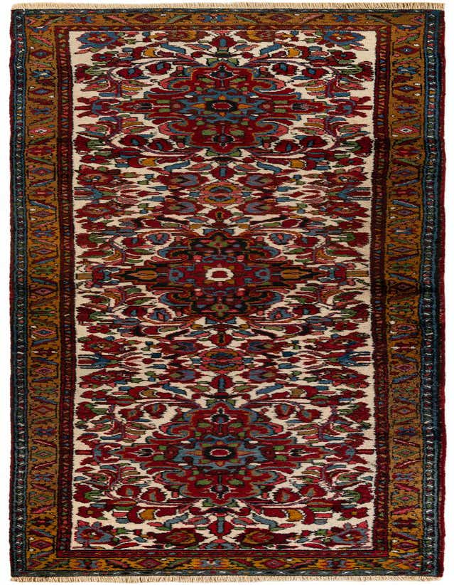A 11 ft runner rug with a traditional Persian pattern in ivory, red, blue, and gold, ideal for a hallway.