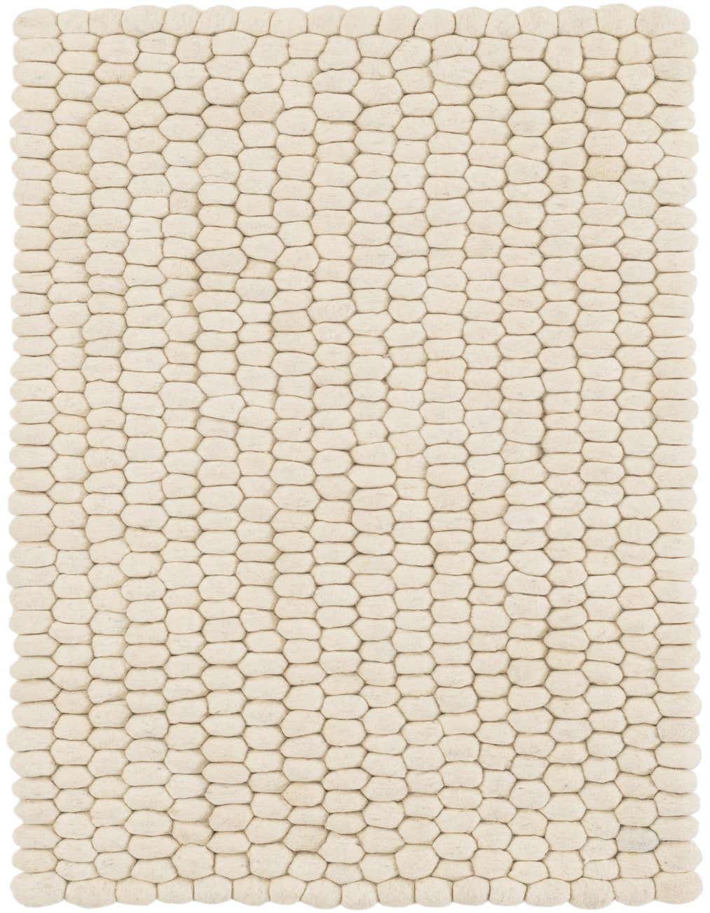 A 4 Ft Felt Ball runner rug in ivory and cream, featuring a textured, shag pile made of individual wool felt balls.