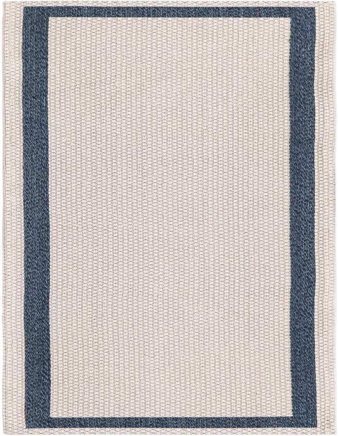 A 6 ft runner rug with an ivory and cream flatweave center and a solid navy blue border, ideal for a hallway or kitchen.