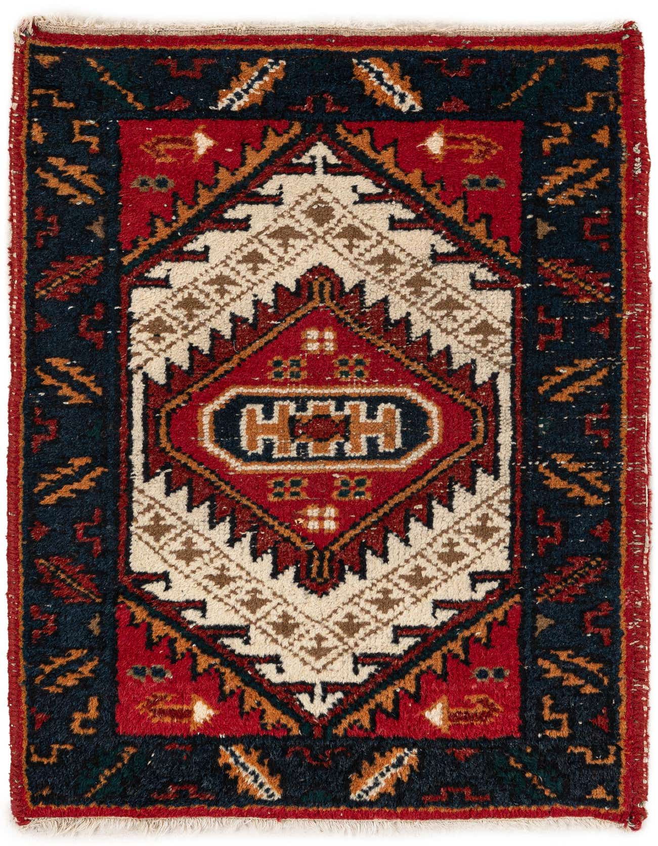 A 4 ft runner rug in a traditional Heriz pattern, featuring a central medallion in red, navy, and ivory.