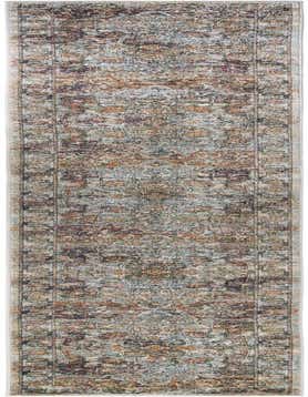 A 20 ft runner rug from the Isabella collection, featuring a distressed traditional medallion pattern in ivories, creams, and whites.