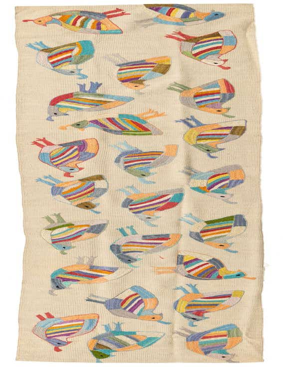 A 9 ft Kilim Suzani wool runner rug with a cream background and colorful, abstract bird-like figures in various hues.