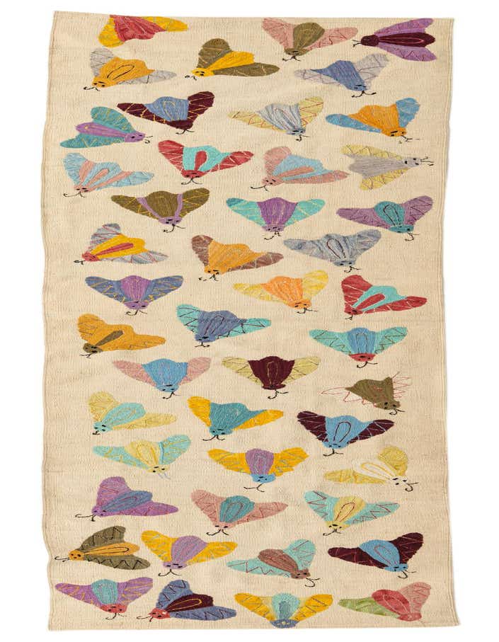 A 9 ft runner rug with an ivory background, featuring colorful embroidered moths in various shades of blue, purple, yellow, and red, arranged in rows.